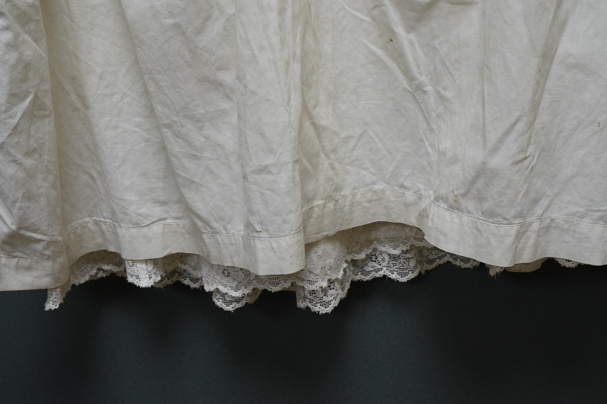 Three 20th century baby’s cotton and machine lace night-dresses